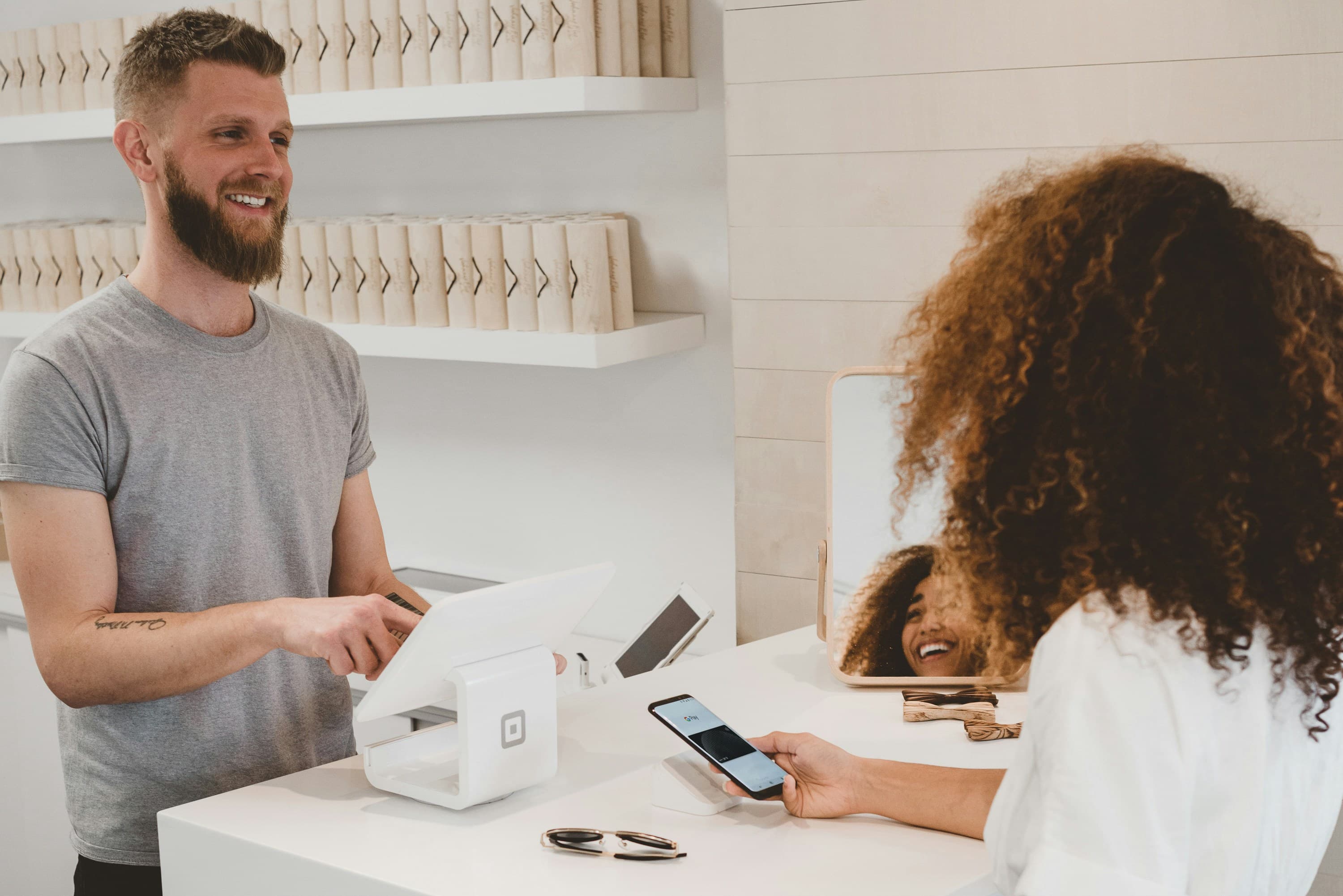 Merchant assisting customer at counter